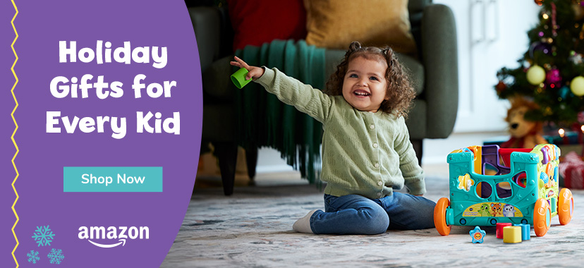 Holiday Gifts for Every Kid; Shop How, Amazon logo, little girl playing with activity wagon 