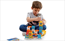 Child building the Marble Rush Discovery Starter Set.